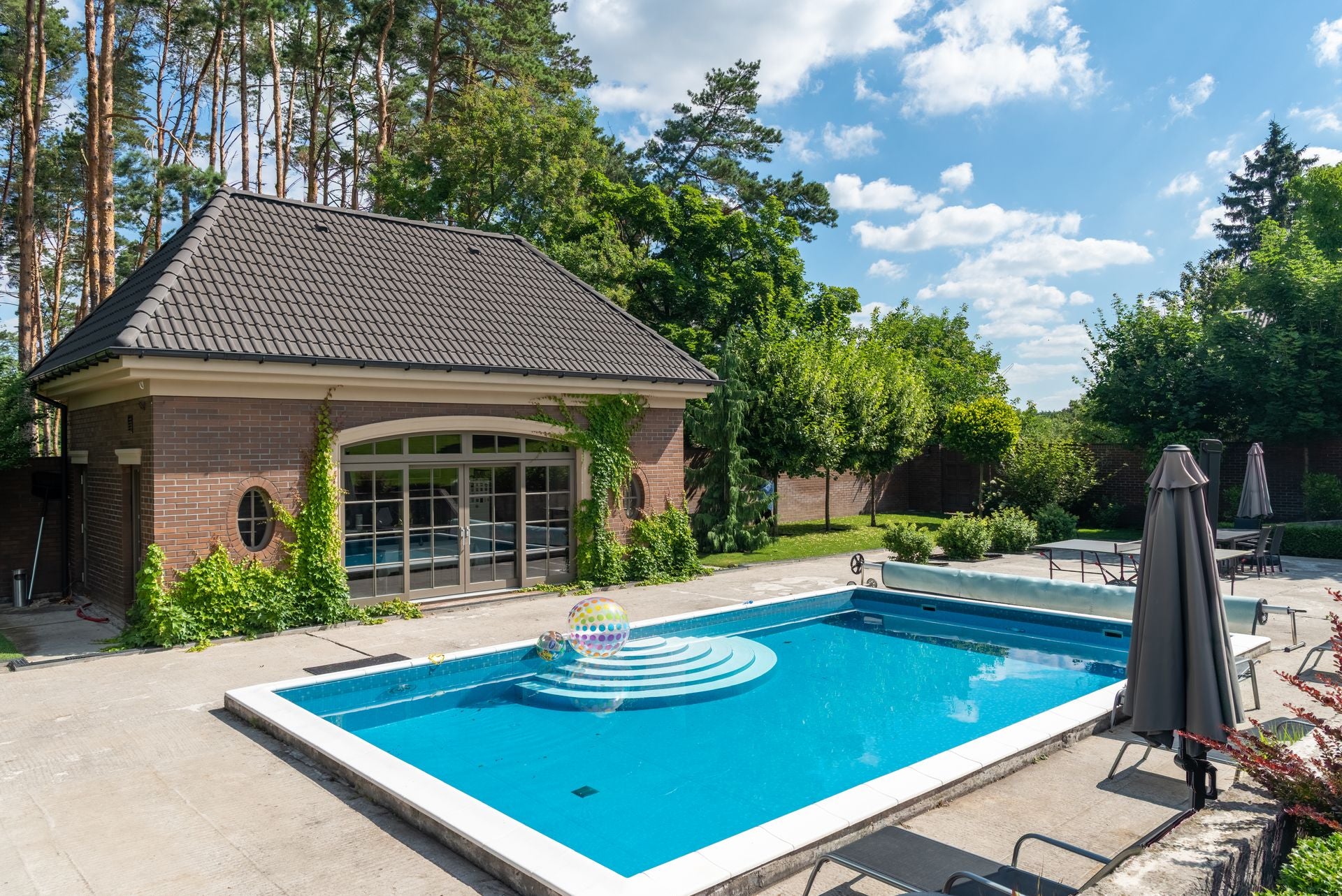 UK garden swimming pool with safety cover - Poolbot hero